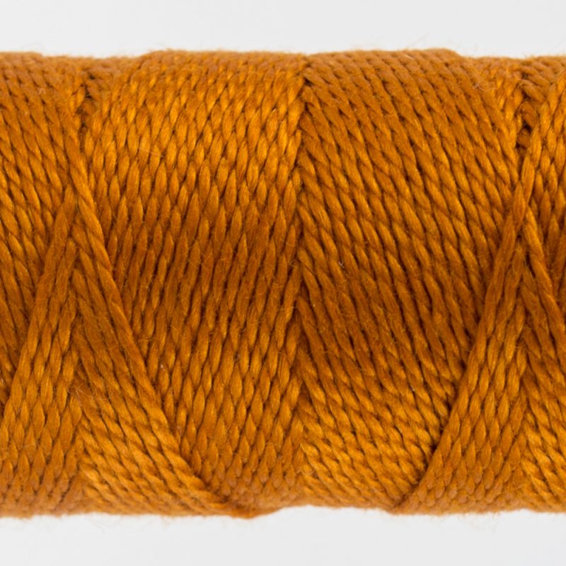 closeup of ochre perle cotton thread