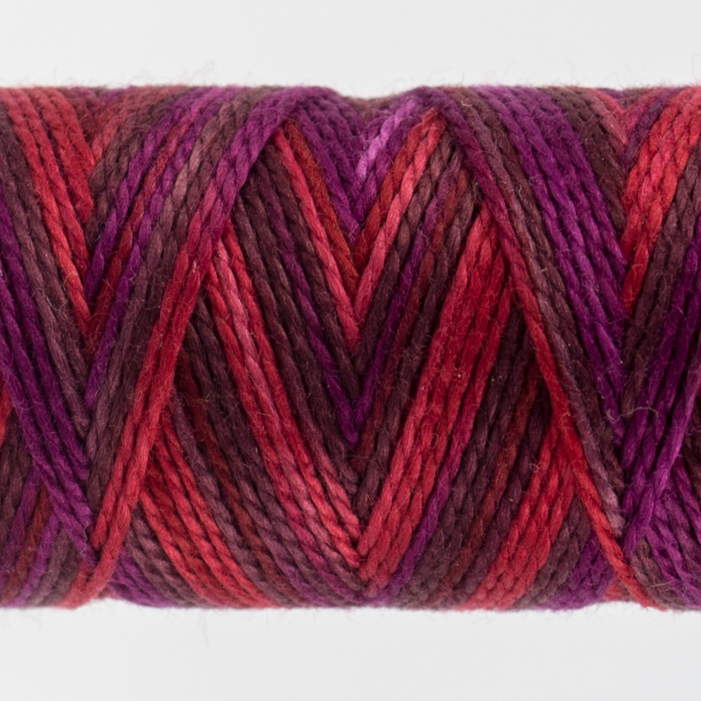 closeup of variegated perle cotton thread scarlet colours