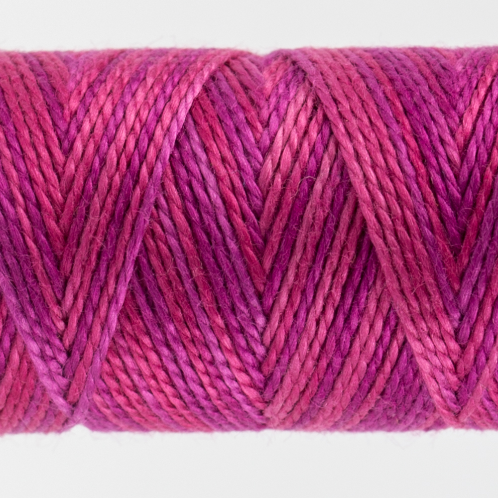 closeup of variegated perle cotton thread fuchsia colours