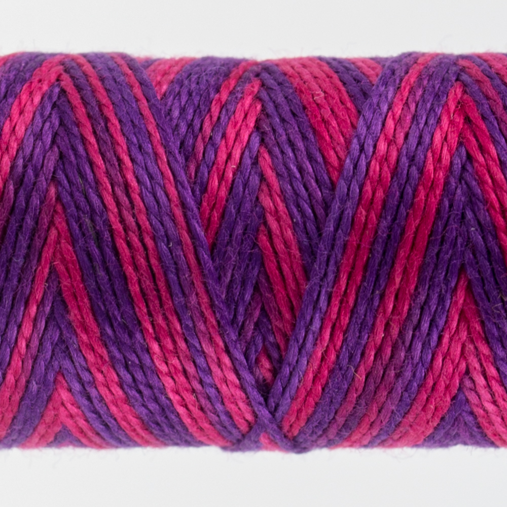 closeup of variegated perle cotton thread purple pink colours